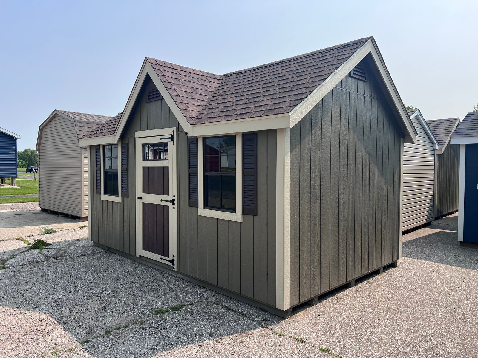 10x16 Painted Deluxe Chalet - QP1072 - Cedar Springs Lot - Cedar Rock Barns